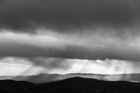 Sunrays Coming Over Mountains Beneath Moody Clouds Stock Image Image