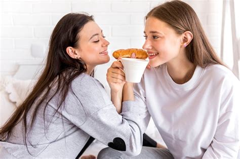 Free Photo Sweet Lesbian Couple Eating Breakfast