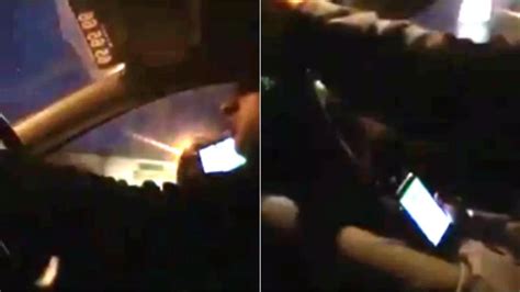 taxi driver risks passenger s life as he orders chicken kebab on his phone while driving at
