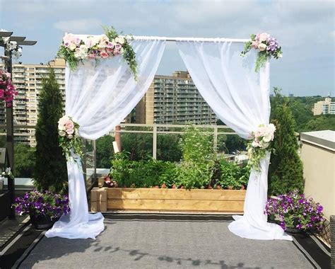 Dress up a basic wooden arbor with asymmetrical flower arrangements and draping for. Flower Arch Rental - Flower Arches Canada