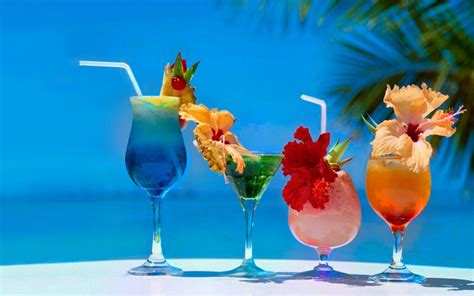 Four Different Cocktails On The Beach