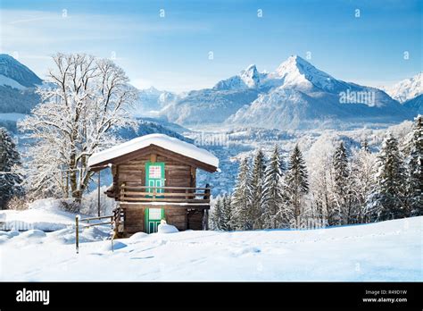 Beautiful View Of Traditional Wooden Mountain Cabin In Scenic Winter