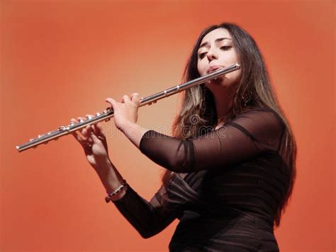 Beautiful Flutist Beautiful Girl Playing Flute At The Concert