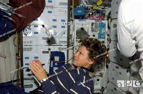 Astronaut Eileen M Collins Sts 114 Commander Watches A Container Of