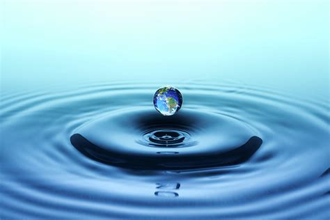 Water Drop With Reflection Of The Globe Photograph By Trout55 Fine