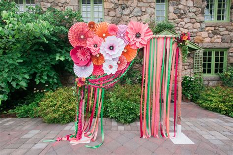 Whimsical Paper Flower And Ribbon Wedding Arch