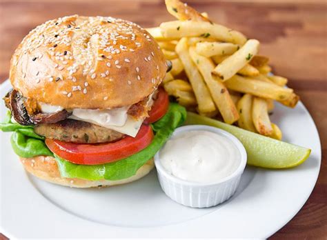 Make the easy and delicious chicken burger recipe at home using ingredients like chicken, milk, tomato, green onion, cucumber, burger buns. Burger Recipes