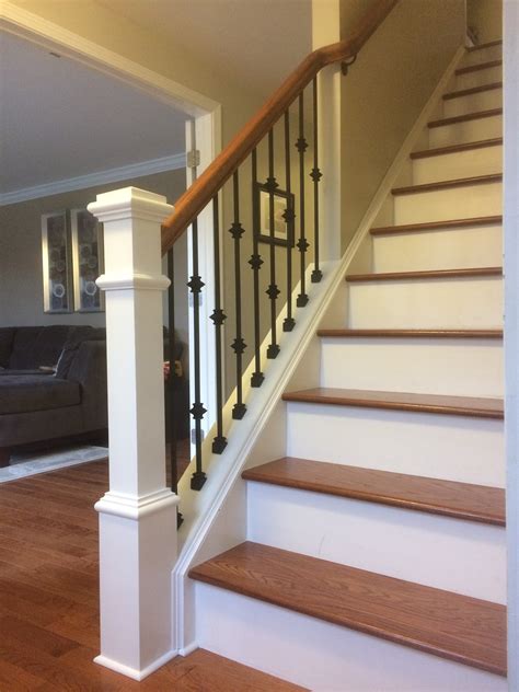 A baluster, often referred to as stair spindles, combine true architectural features, with expert craftsmanship. Wood railing with wrought iron balusters - Lux Design and Contracting