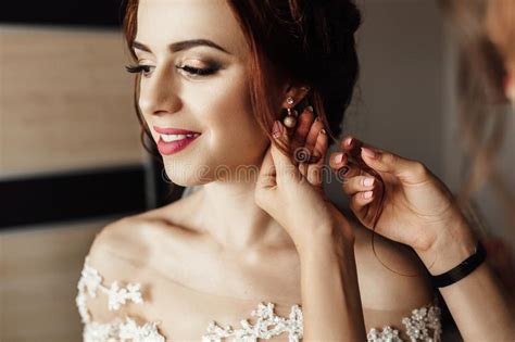 bridesmaids whirl bride`s veil while she smiles stock image image of elegance earrings 108006905