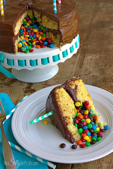 Surprise cake with rainbow and candy inside. Surprise Inside Pinata Cake - This Silly Girl's Kitchen