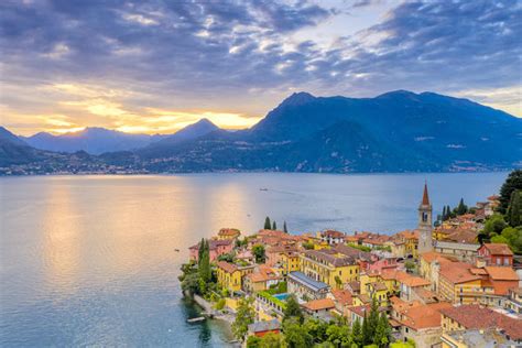 Burning Sky At Sunset Over Varenna Old Town And Lake Como Lecco Province Lombardy Italy