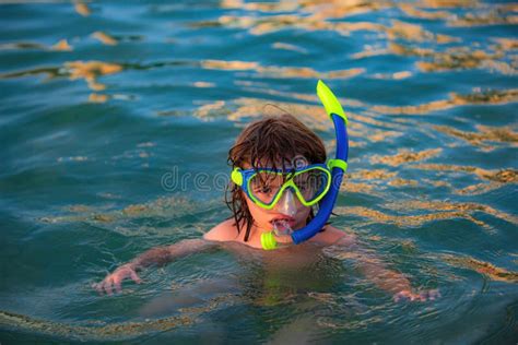 Happy Child Playing In The Sea Kid Snorkeling In The Ocean Stock