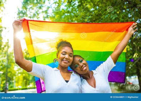 brazilian lesbian couple in white dress spending time together celebrating engagement in summer