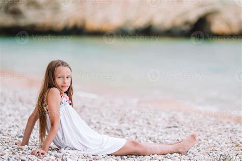 Cute Little Girl At Beach During Summer Vacation 18107915 Stock Photo