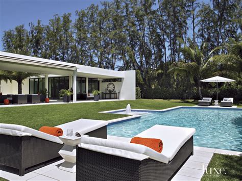 Contemporary Neutral Poolside With Wicker Furniture Luxe Interiors