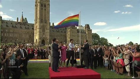 image of justin trudeau with the gay pride flag helasem