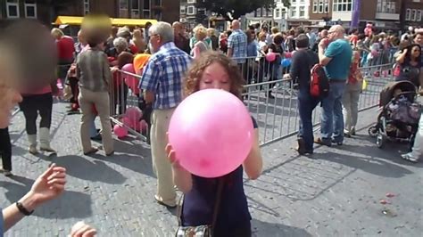 116 Girl Blow To Pop Big Pink Balloon At Parade Looners Paradise