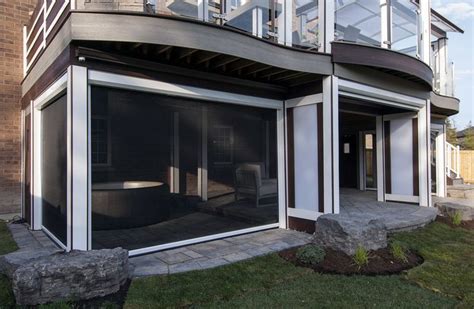 Phantom`s Motorized Retractable Screens Covered Outdoor Living Space In