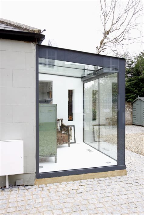 Glass Box Extension To Home In Esher With Grey Backpainted Bands And A