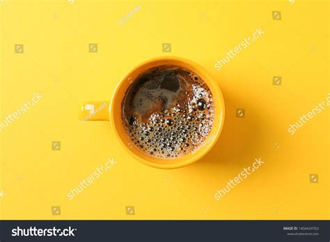 Cup Of Coffee With Frothy Foam On Color Background Space For Text And
