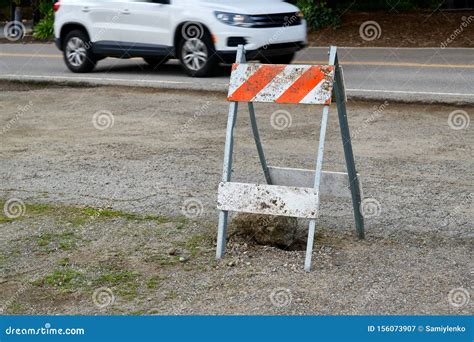 Construction Barricade With A White Car On The Background Stock Image