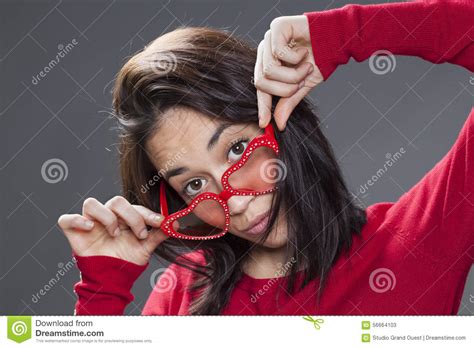 20s Woman Looking Over Her Fun Red Glasses Stock Image Image Of Brunette Cheeky 56664103