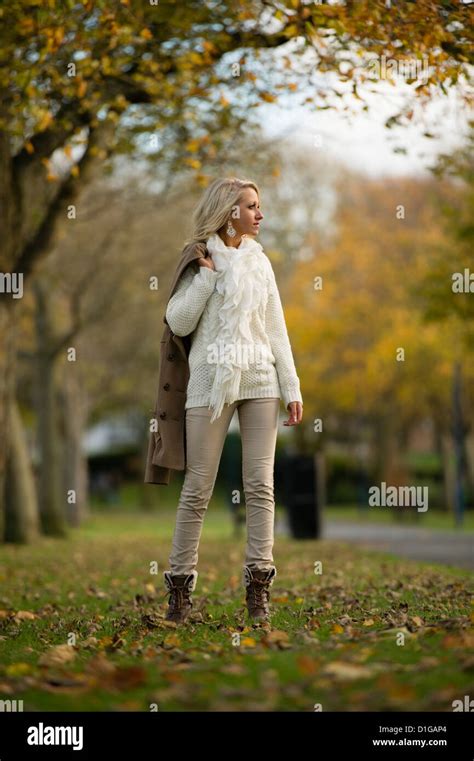A 16 17 Year Old Blonde Slim Teenage Girl Walking In The Park On An