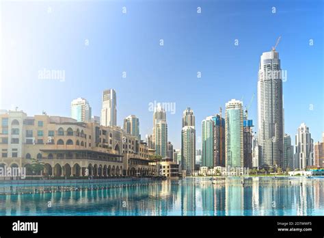 Downtown Dubai Skyline In Morning With High Rise Buildings Reflected In