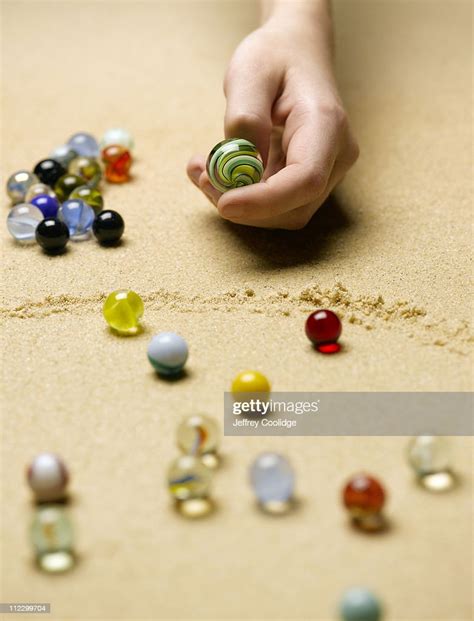 Hand Playing Marble Game High Res Stock Photo Getty Images