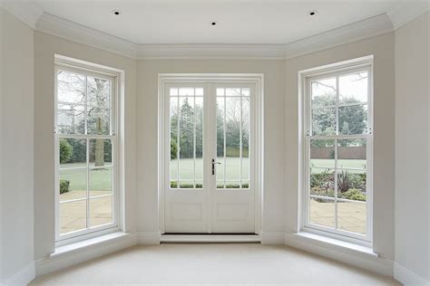 A Beautifully Crafted Set Of Georgian Style White Wooden Bay Windows