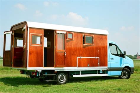 You may prefer to build your own vw camper furniture also if you have a limited budget. A Mobile Home With A Wooden Exterior And A Retro Look