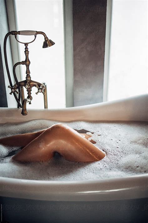 Legs Of A Woman Lying In The Bathtub By Stocksy Contributor Lumina
