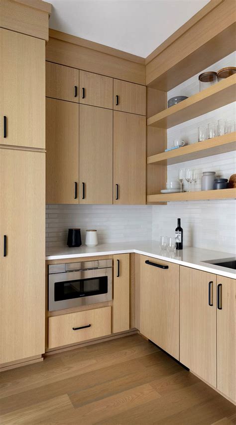 Light Wood Cabinets With Black Handles And Wall Shelfs Natural Wood