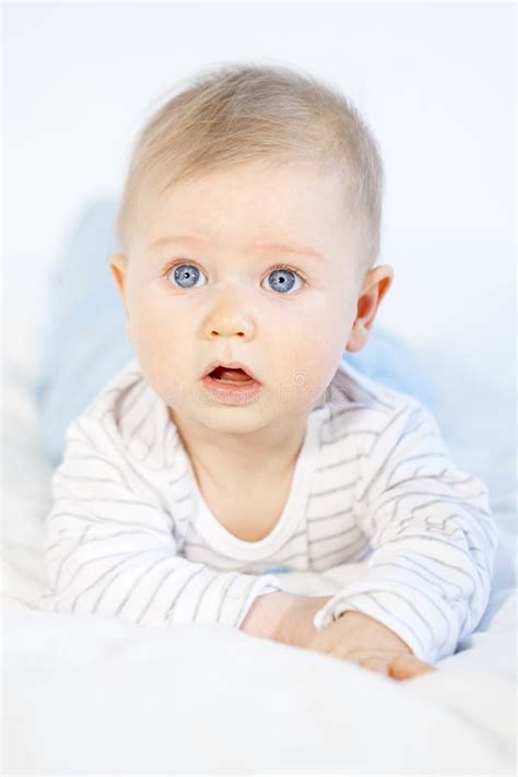 Beautiful Baby Boy Lying In Bed On White Background Stock Photo Image