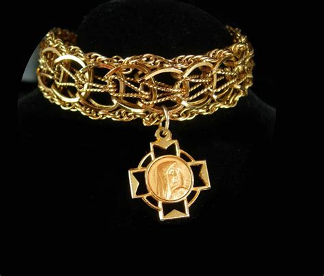 This Vintage 120 12kt Gold Filled Bracelet Is Quite Wide And Detailed From It Hangs A Cross