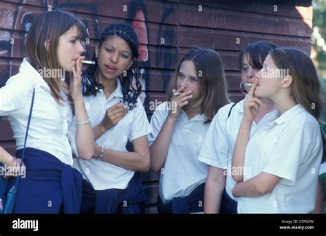 Five Secondary School Girls Smoking Behind Shed Stock Photo Royalty
