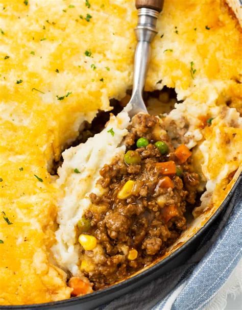 This easy shepherd's pie recipe is filled with lots of veggies and tender ground beef (or lamb), simmered together in the most delicious sauce, and topped with the creamiest mashed potatoes. Easy Shepherd's Pie - The Cozy Cook