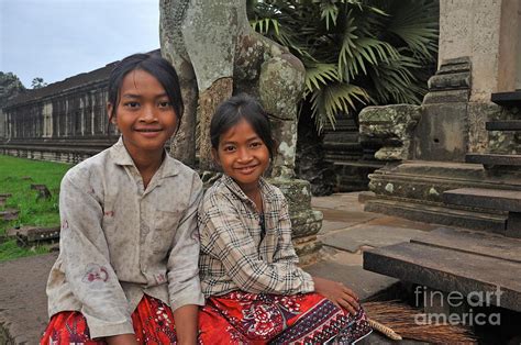 Two Young Cambodian Girls In Angkor Wat Photograph By Sami Sarkis