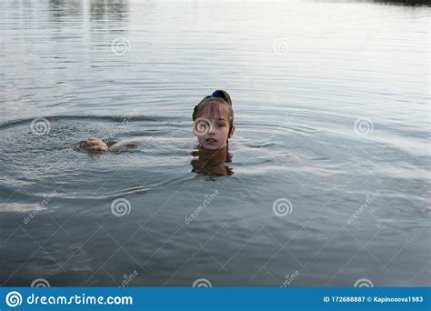 Pleasure Beautiful Little Girl Swim In Blue Water Lean Out Of Water