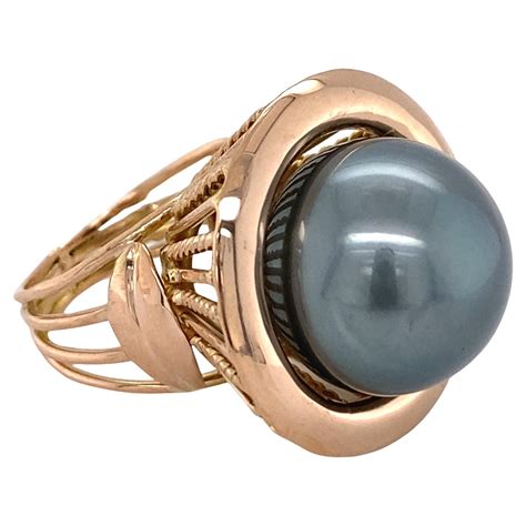 15mm Mobe Pearl Ring With Surrounded Diamonds Set In White Gold