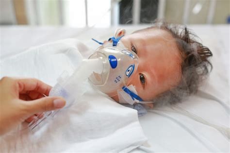 Premium Photo Sick Baby Boy Applying Inhale Medication By Inhalation