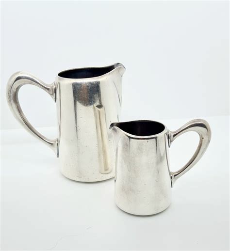 Christofle Set Of 2 Carafes Milk Jugs Of Different Catawiki