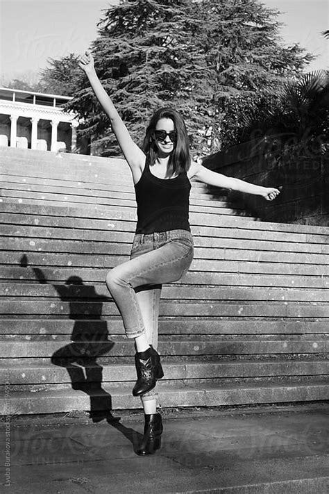 Woman Having Fun Outdoors By Lyuba Burakova Dancing Happy Stocksy United
