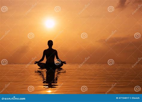 Woman Practicing Yoga Standing In Goddess Pose Sumo Squat Exercise