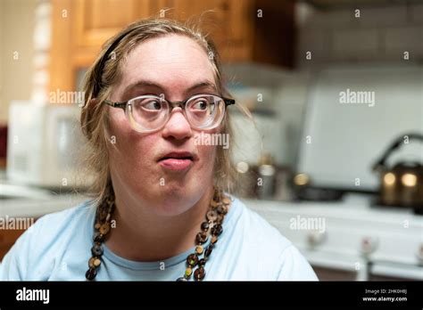 Indoor Portrait Of A 39 Year Old Woman With Down Syndrome In The