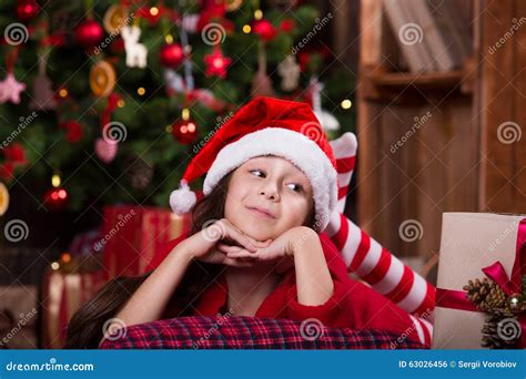 Portrait Of Cute Girl In Santa Hat Falling Asleep Stock Photo Image