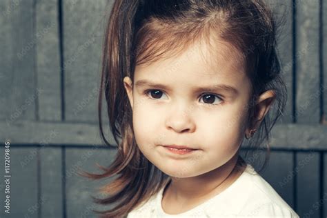 Small Girl Making Faces Stock Photo Adobe Stock