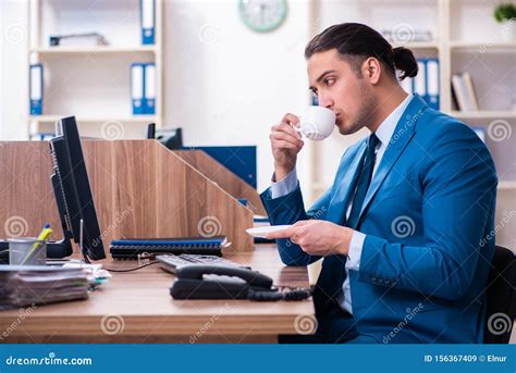 Young Handsome Businessman Sitting In The Office Stock Image Image Of