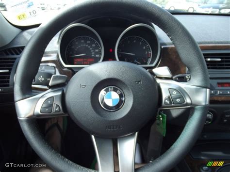 The steering, too, although nicely weighted, doesn't offer much in the way of feedback. 2007 BMW Z4 3.0si Coupe Steering Wheel Photos | GTCarLot.com