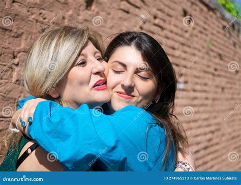 Mother And Daughter Hugging And Expressing Affection In Mother S Day